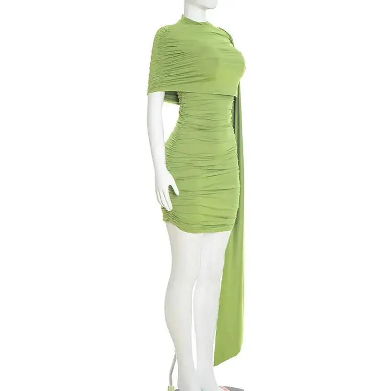 Green ruched dress on a mannequin against a white background