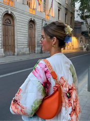 Back view of a floral quilted bomber jacket