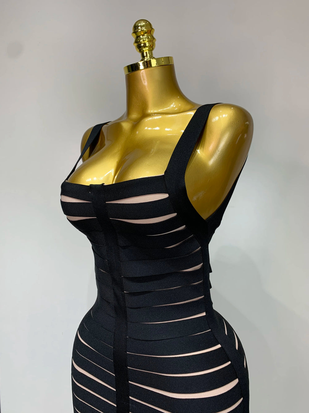 Close-up of the bodice on a sleeveless square neck bandage midi dress