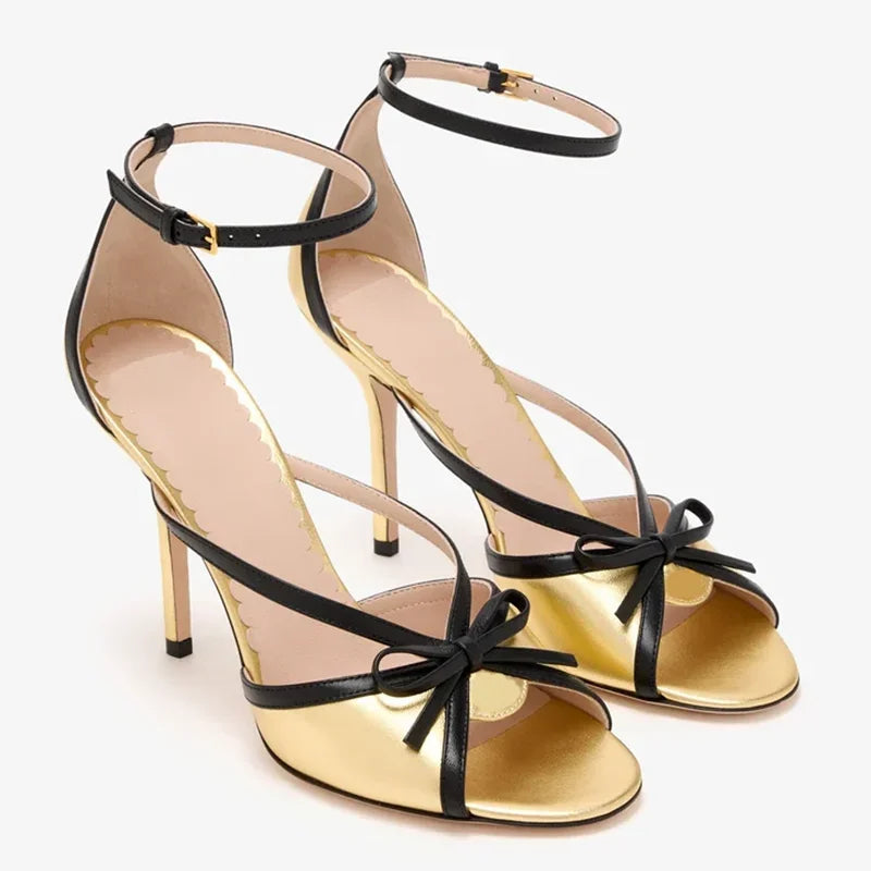 Gold and black butterfly knot ankle strap stiletto heels