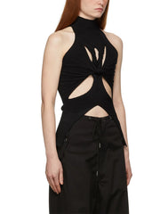 Black sleeveless knit top with cut-out design worn by a model on a white background