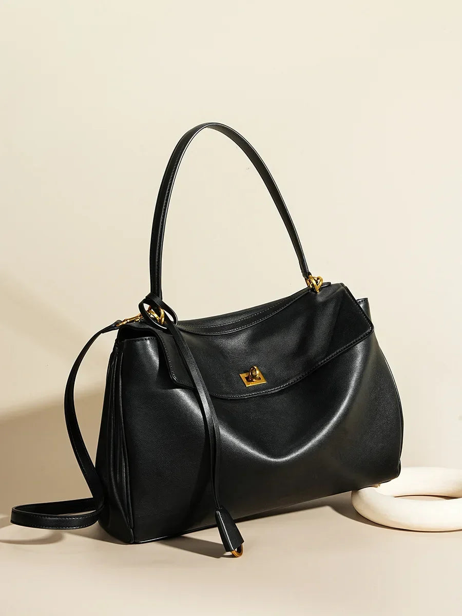 Soft leather Kelly-style tote with gold lock and top handle

