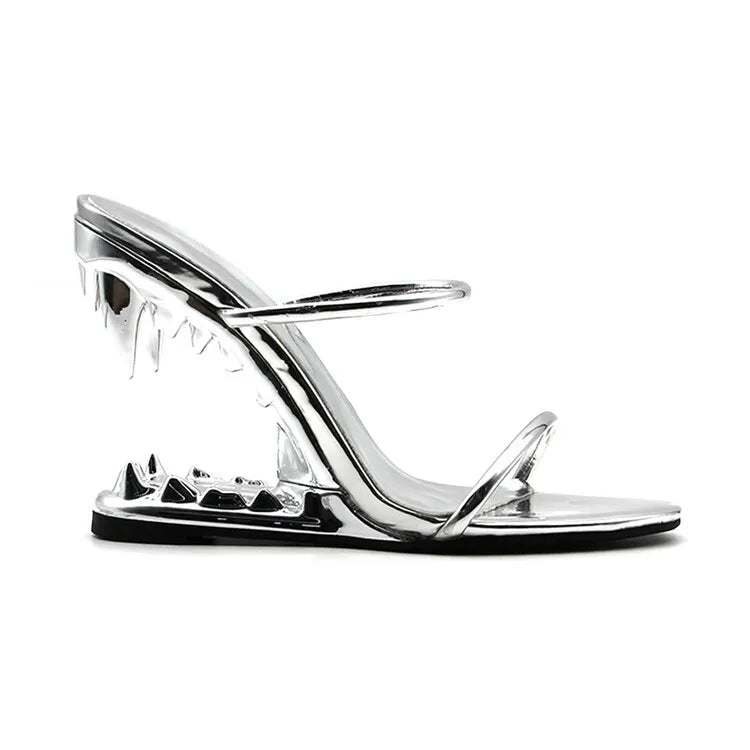 Clear high-heeled sandal with metallic finish on a white background