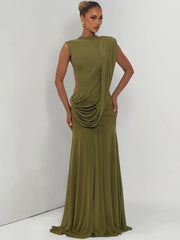 Model wearing a green draped mock neck sleeveless maxi dress