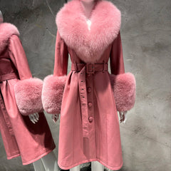 Pink coat with fur trim on a mannequin against a gray background