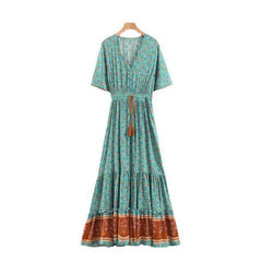 Bohemian floral print V-neck maxi dress hanging on a hanger