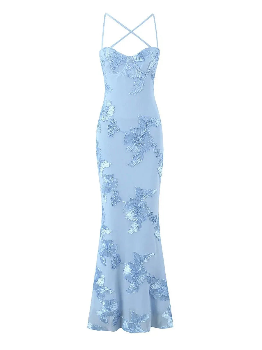 Light blue floral dress with thin straps on a white background