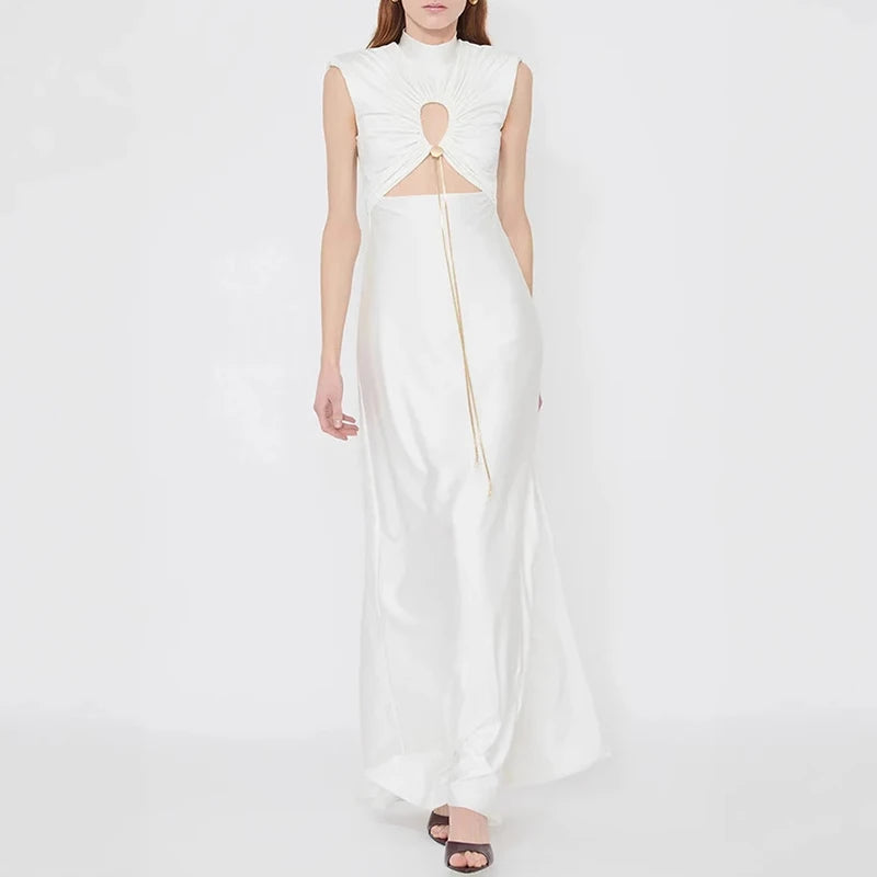 White sleeveless dress with cut-out design on a white background