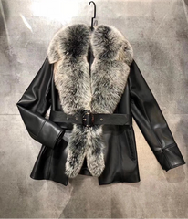 Black leather jacket with fur collar on a gray background