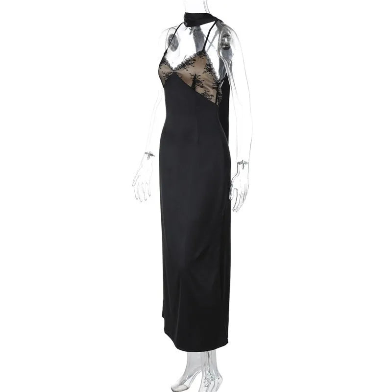 Black evening gown with lace detailing on a mannequin against a white background