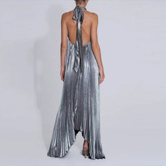 Silver metallic halter neck dress with a long train on a white background