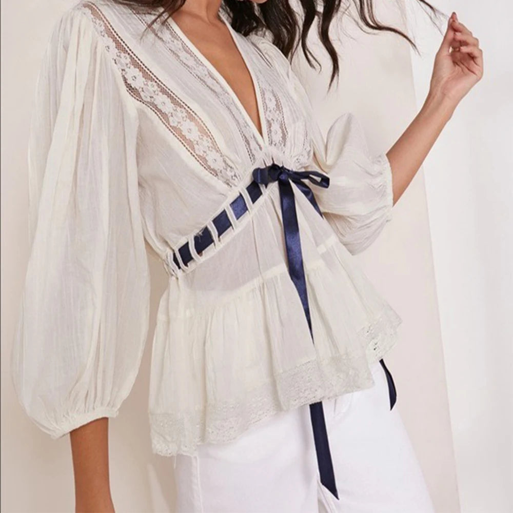 White puff sleeve lace trim peplum top shown from side