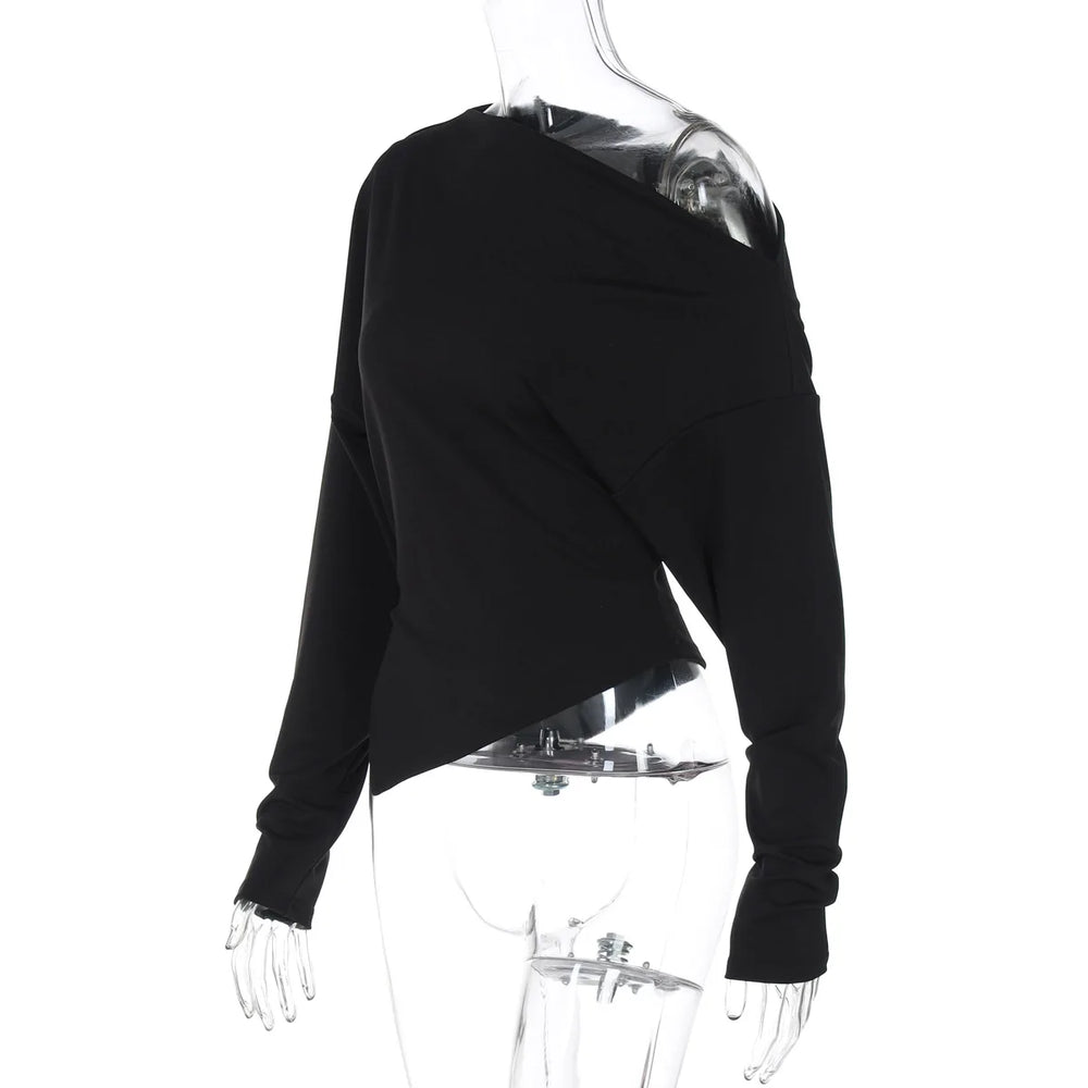 Black long-sleeve top on a transparent mannequin against a white background