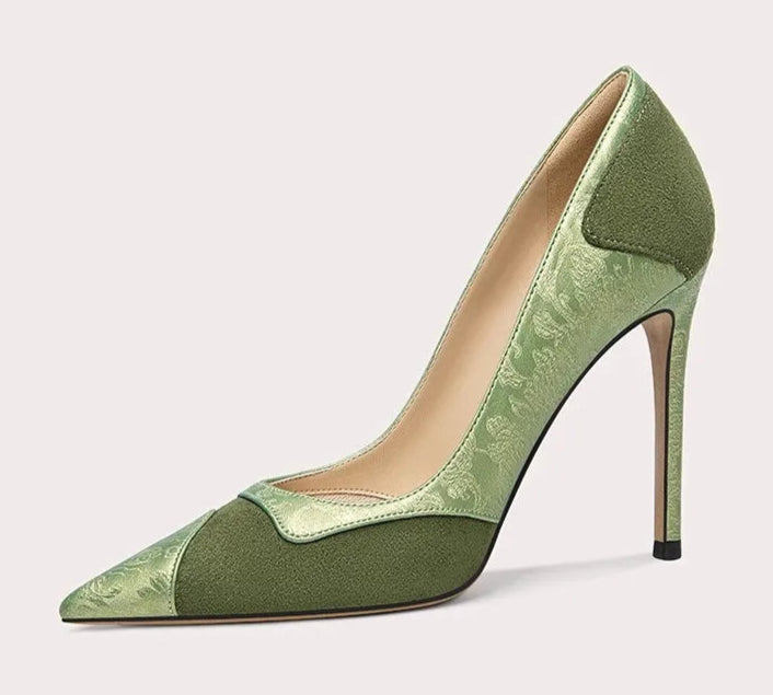 Green high-heeled shoe on a white background