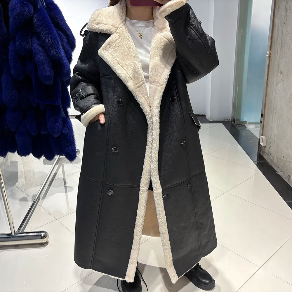 Person wearing a black coat with white fur lining in a store setting.