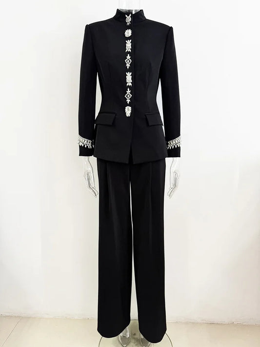 Black embellished stand collar jacket and wide leg pants suit on a mannequin