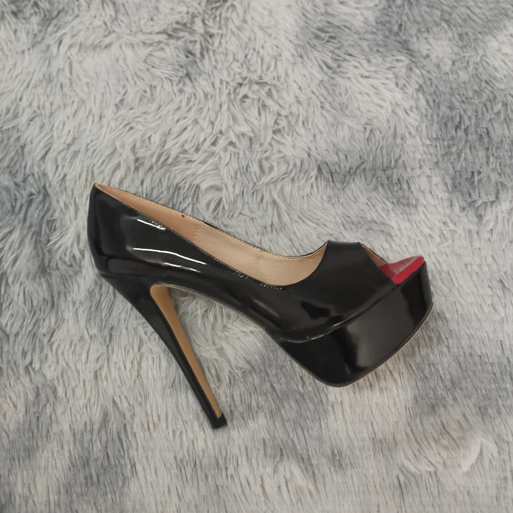 Black high-heeled shoe with a red sole on a gray fur surface