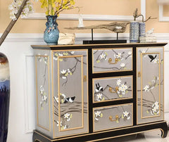 Decorative cabinet with floral patterns in a room setting