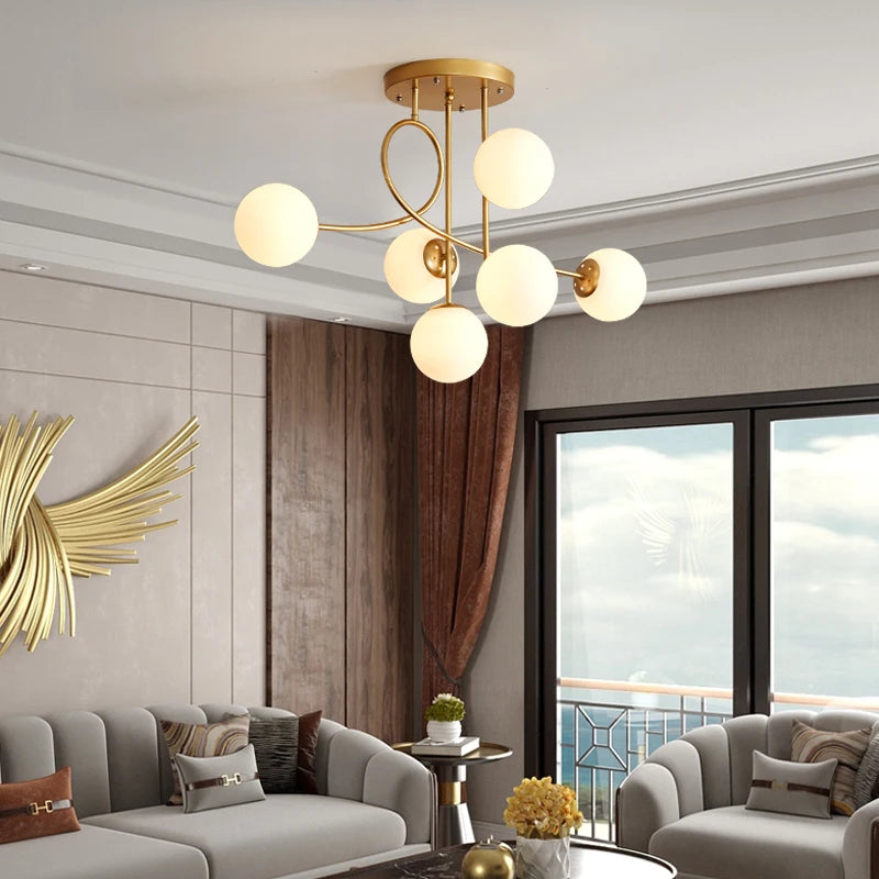 Magic bean glass ceiling LED pendant light with gold iron branches and clear glass globes in modern living room