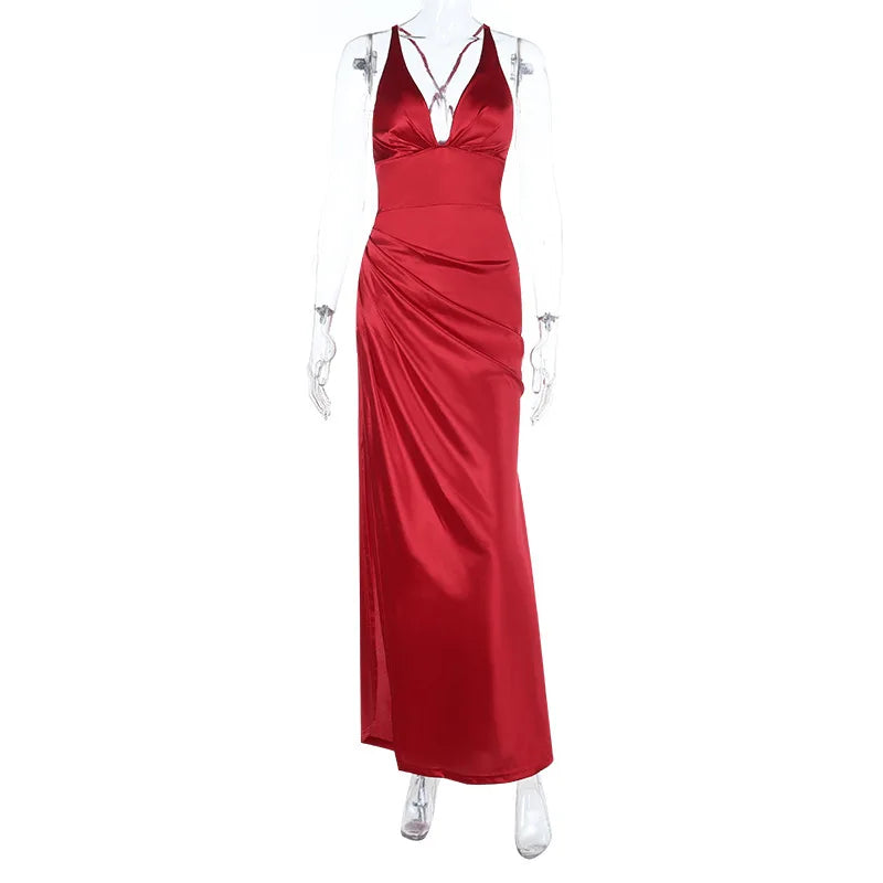 Red evening gown on a mannequin against a white background