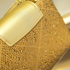 Close-up of a luxurious rhinestone crossbody handbag with rivet details and a top handle Golden Atelier  Golden 3