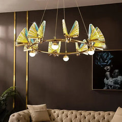 Luxury butterfly chandelier with multicolor glass blades, LED lighting, and brushed stainless finish – ideal for salons, hotels, and upscale interiors