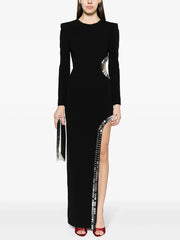 Black long sleeve maxi dress with asymmetric cutout and sequin trim