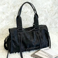 Black faux leather shoulder bag with lacing details
