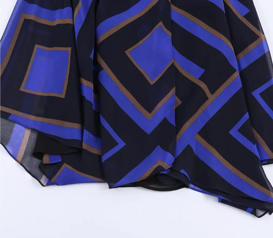 Close-up of geometric print on asymmetrical chiffon midi skirt