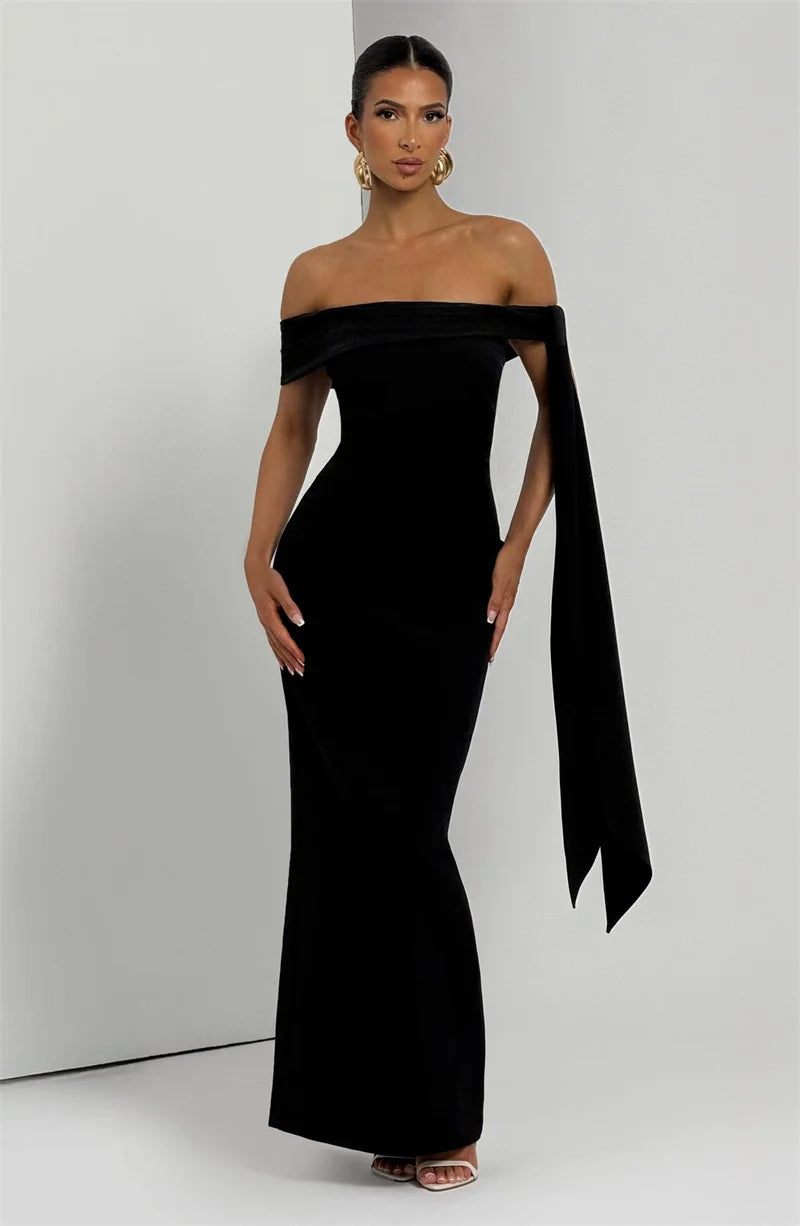 Woman wearing a black off-shoulder gown 