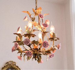 Decorative chandelier with floral design on a plain background