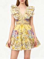 Ruffled V-neck sleeveless tiered mini dress with floral print detail