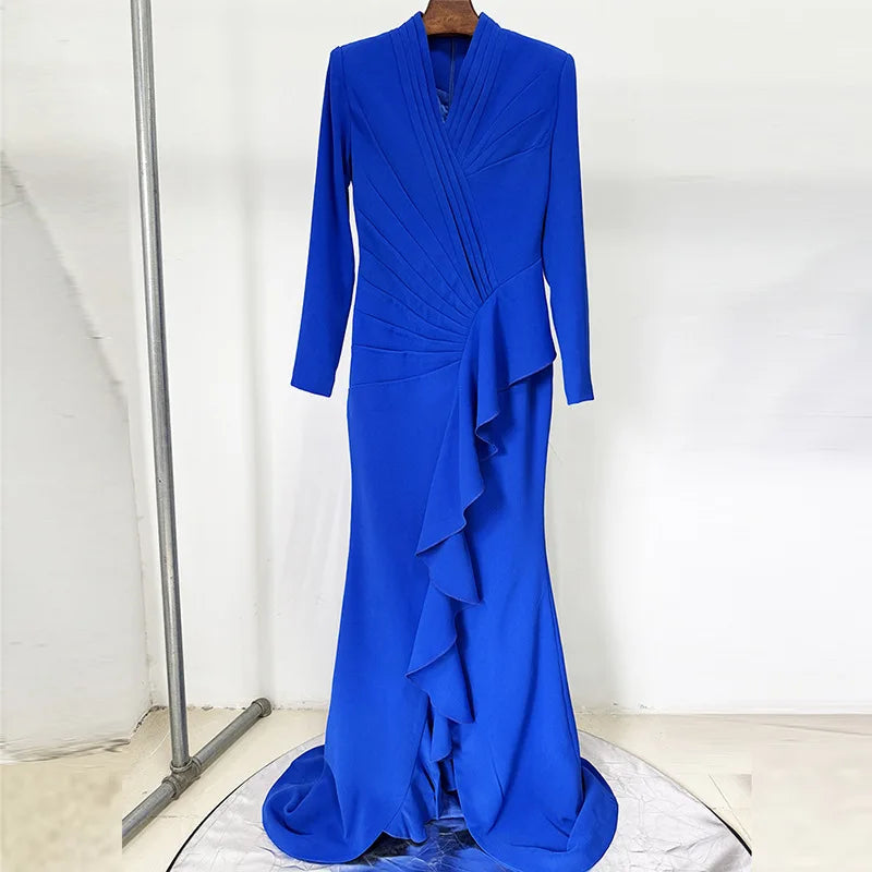Blue evening gown on a hanger against a white background