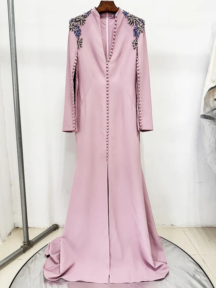 Pink buttoned v-neck maxi dress on a mannequin