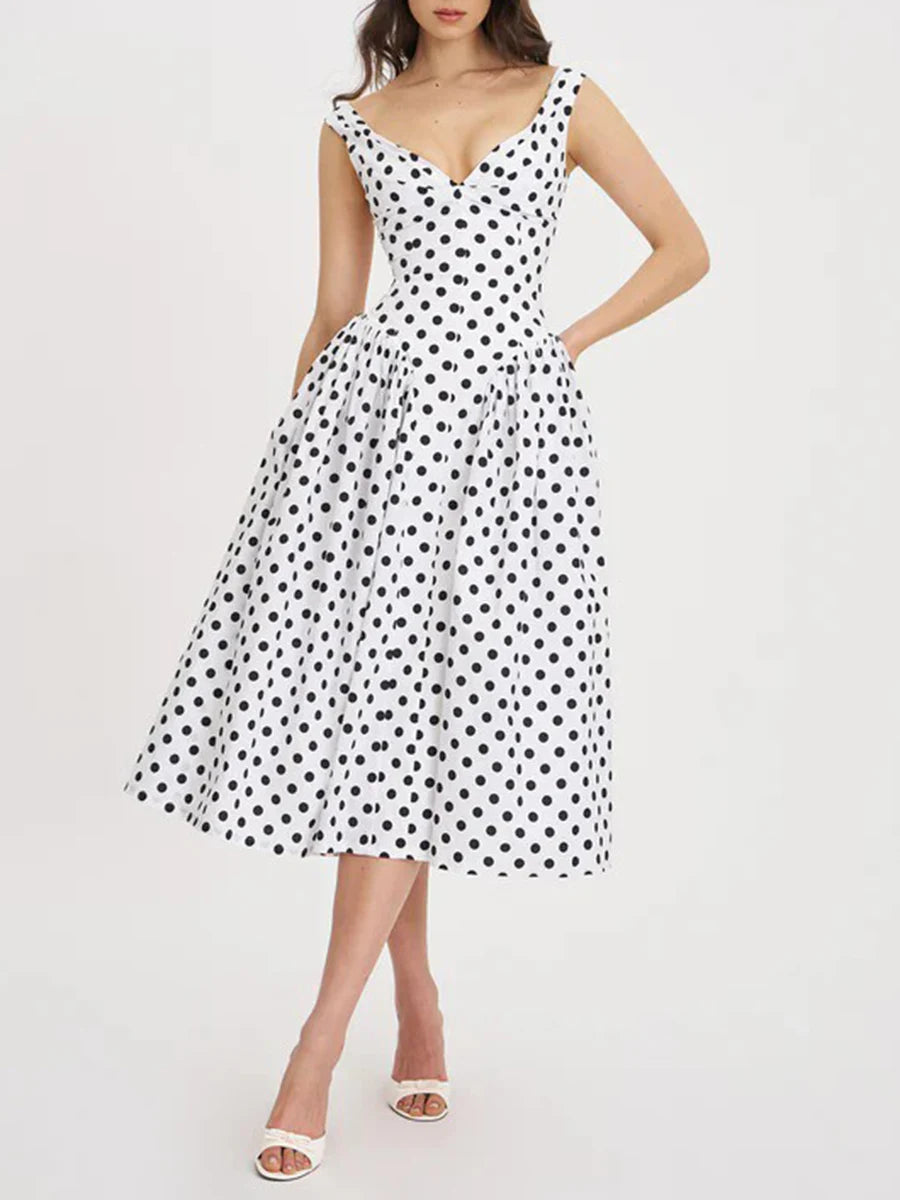 Mid-calf polka dot day dress styled for a summer outing.
