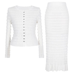 White knit cardigan and midi skirt set laid flat.
