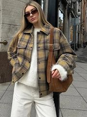 A woman wearing a stylish plaid wool coat with a turndown collar, perfect for fall. Golden Atelier 2