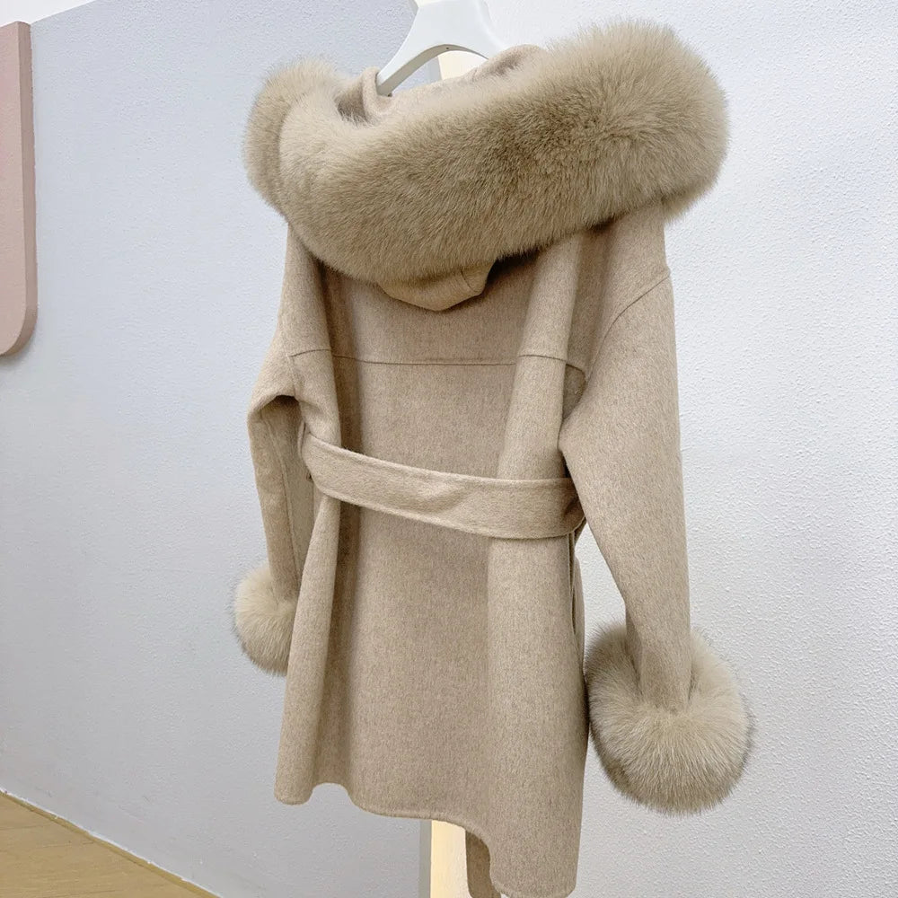 Beige coat with fur hood and cuffs on a white background