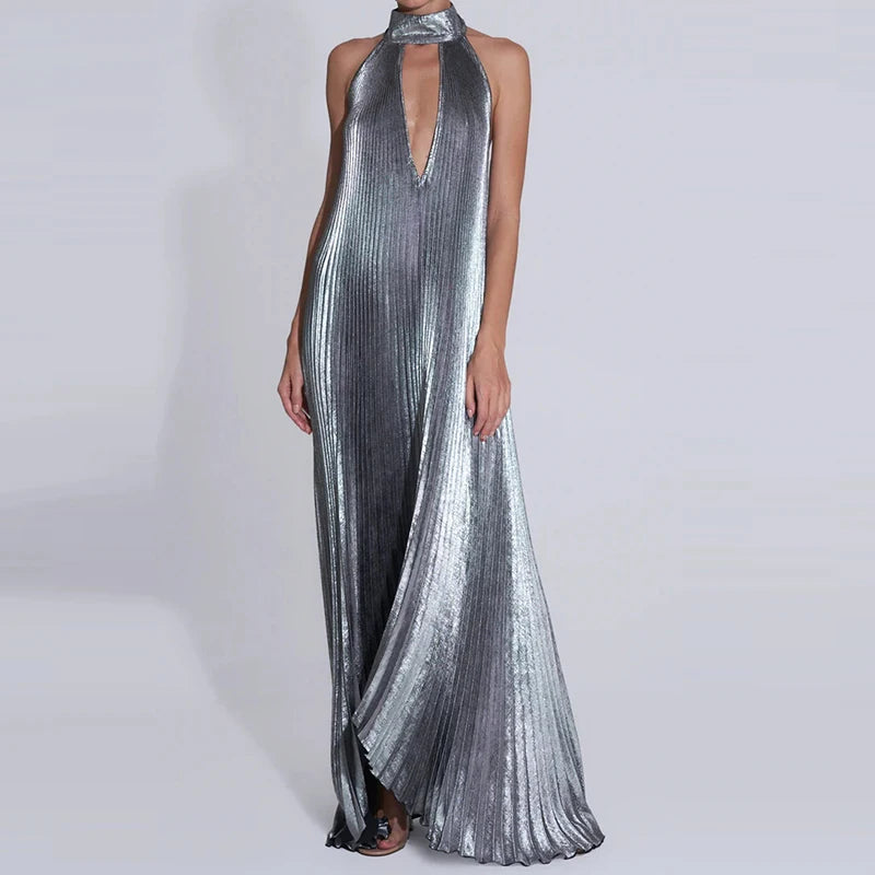 Silver metallic halter neck gown on a white background