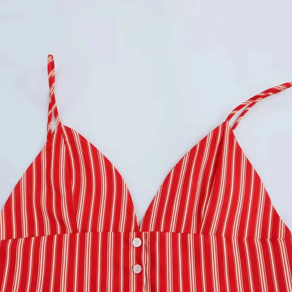 Red and white striped bikini top on a light blue background