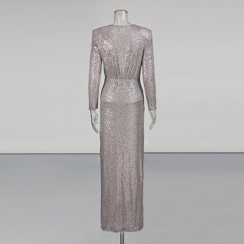 Silver sequin dress on a mannequin against a plain background