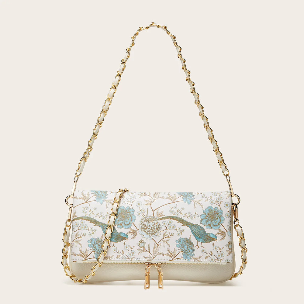 White floral print chain shoulder bag with blue accents