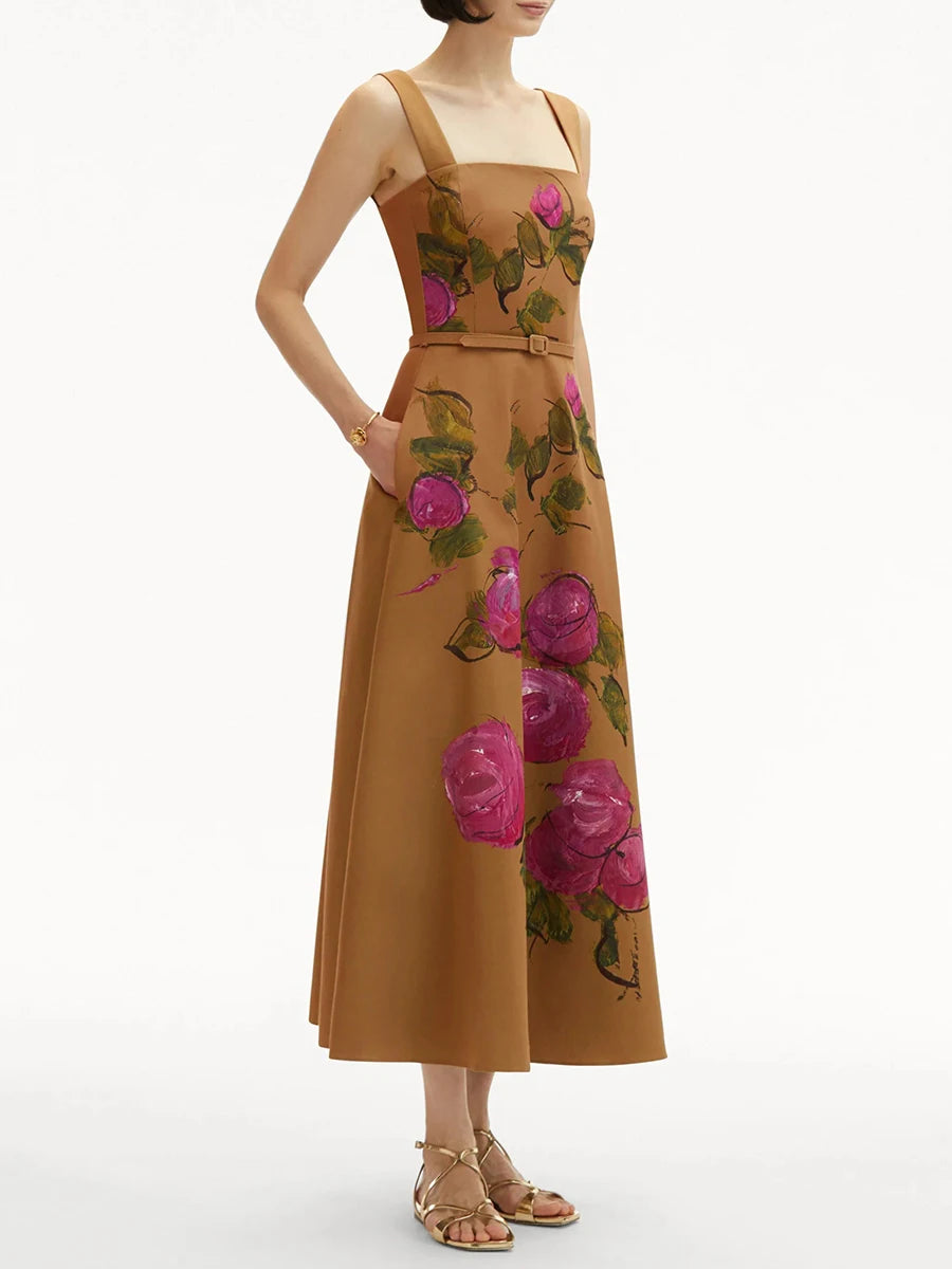 Woman wearing a brown dress with floral patterns on a white background