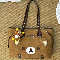 Close-up of brown bear applique tote bag with teddy bear charm
