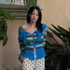 Striped fringed knit cardigan styled with white pants