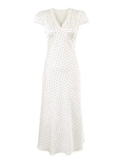 White dress with small black pattern on a white background