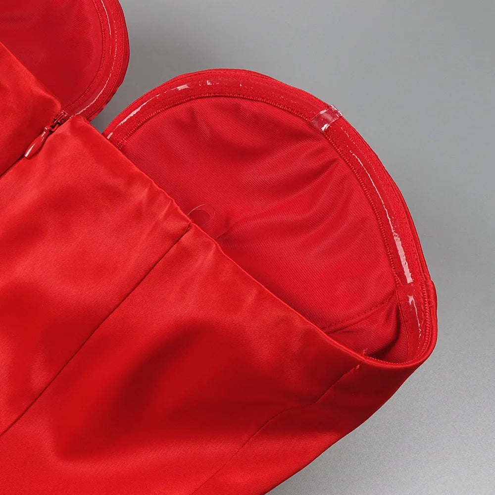 Close-up of a red bag with a zipper on a gray background