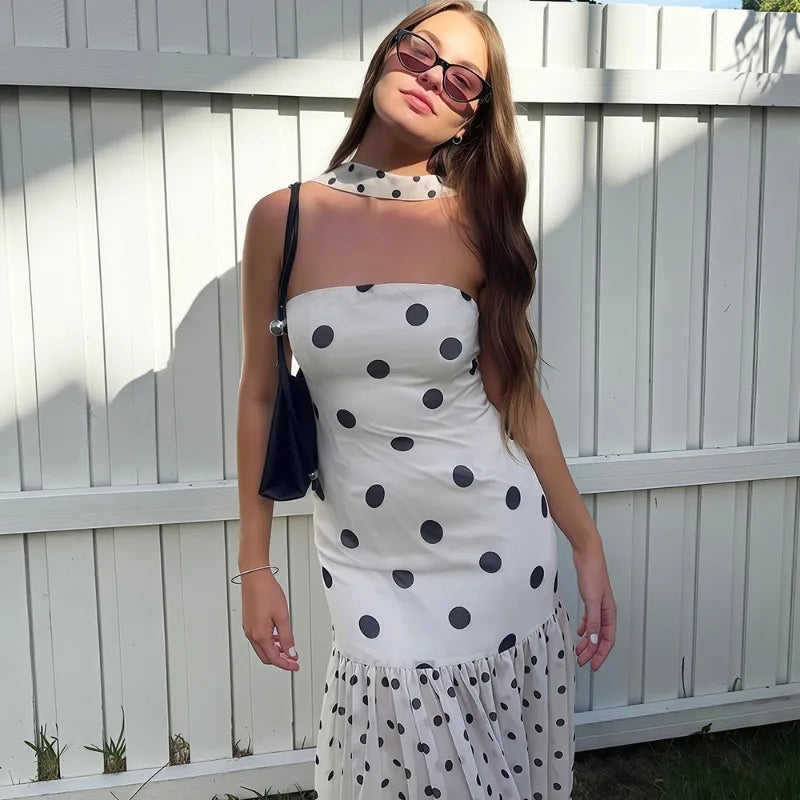 Close-up of a white polka dot maxi dress with scarf detail