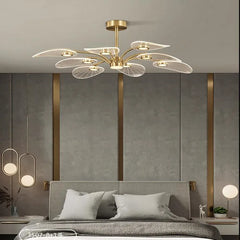  Modern Nordic LED chandelier with copper accents and a lotus leaf design, illuminating a Bed room. Golden Atelier 3