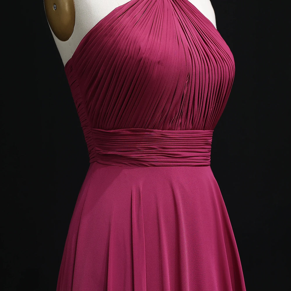 Magenta dress on a mannequin against a black background